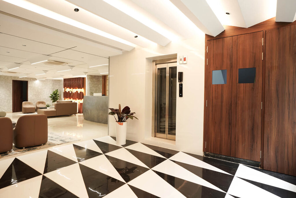 Lift and reception waiting area at Sreeshrestam Apart Hotel, Hyderabad