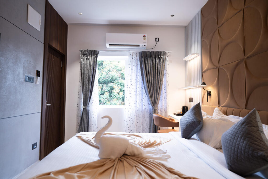 Superior king room with modern interiors and natural light at Sreeshrestam Apart Hotel, Hyderabad